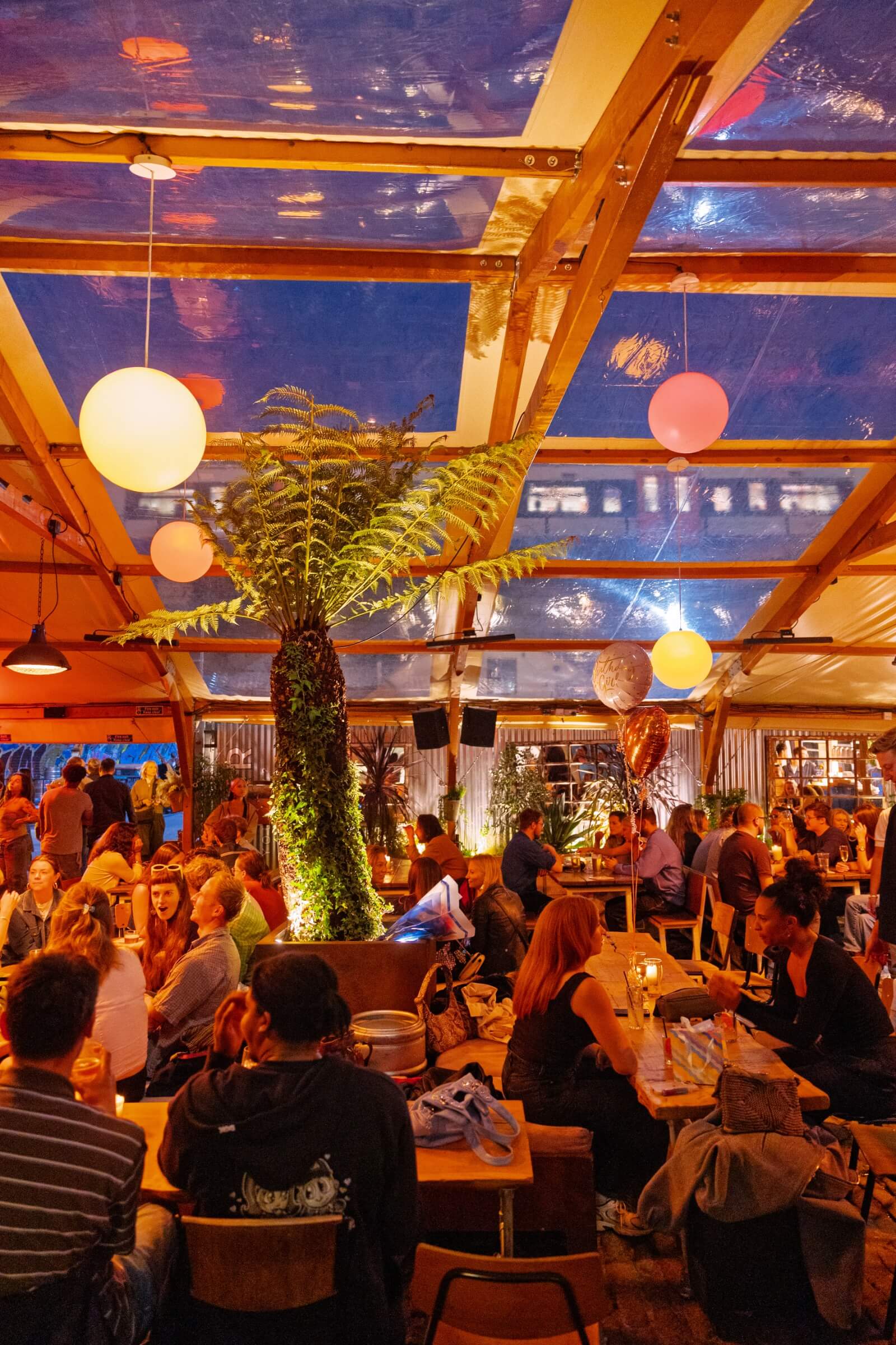 People enjoying drinks in a well lit venue